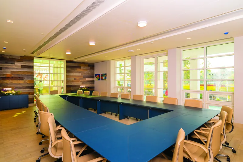 The Board Room with its blue U-shaped table