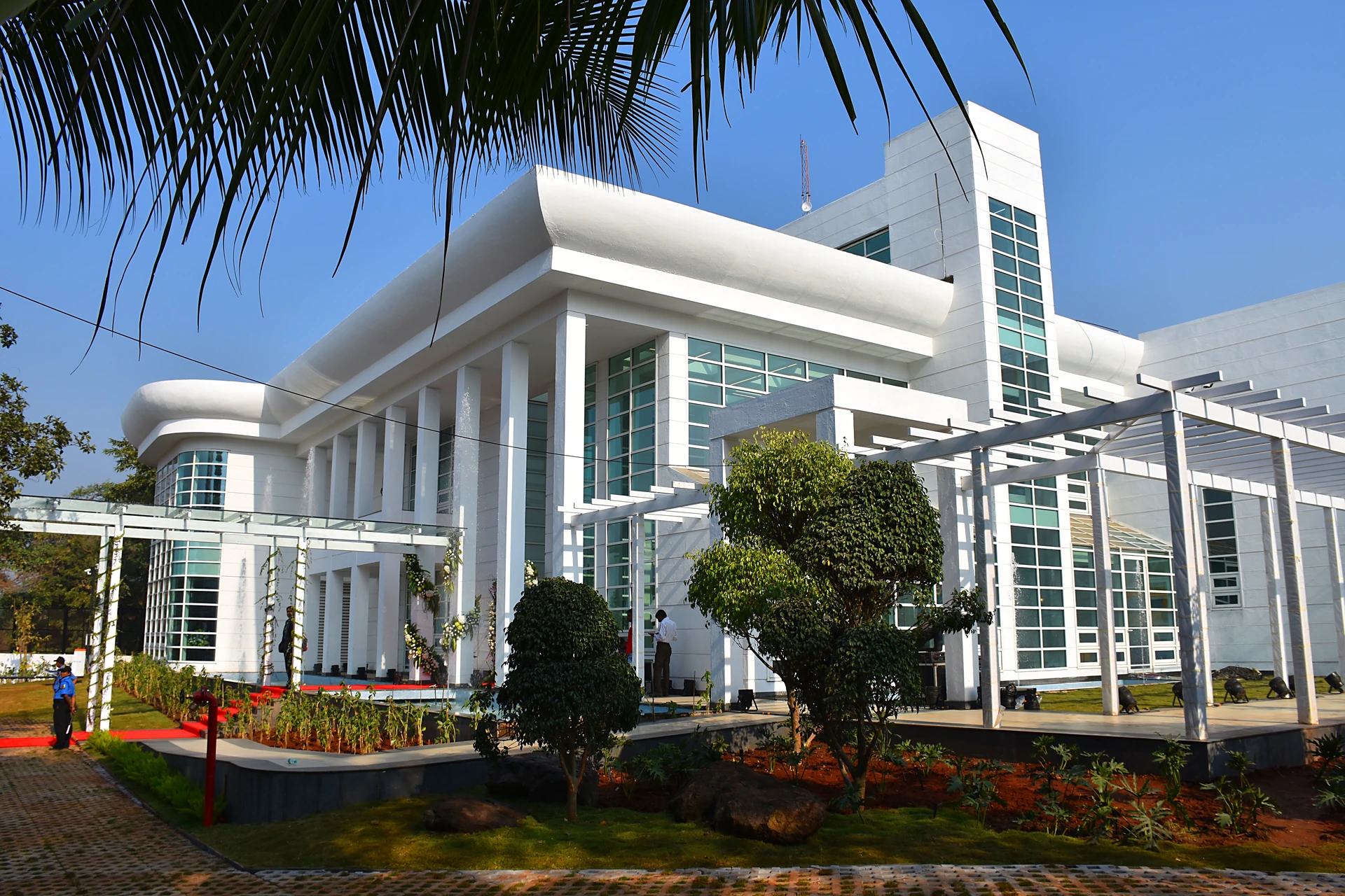 The AliGunjan exterior framed by palms