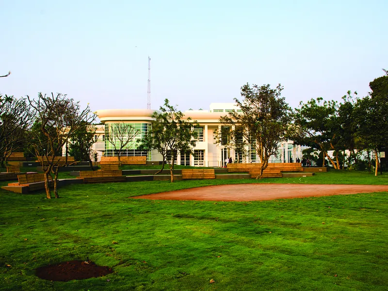 A wide lawn view towards the Imaginarium.