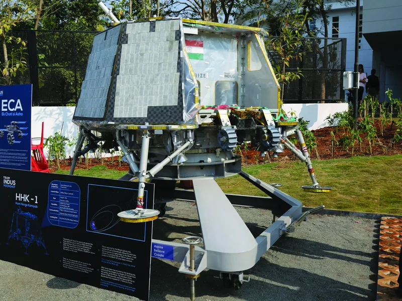 A lunar lander model displayed in the grounds.