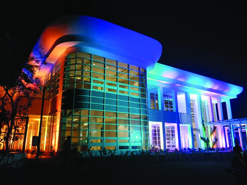 Colourful lighting across the Imaginarium at night.